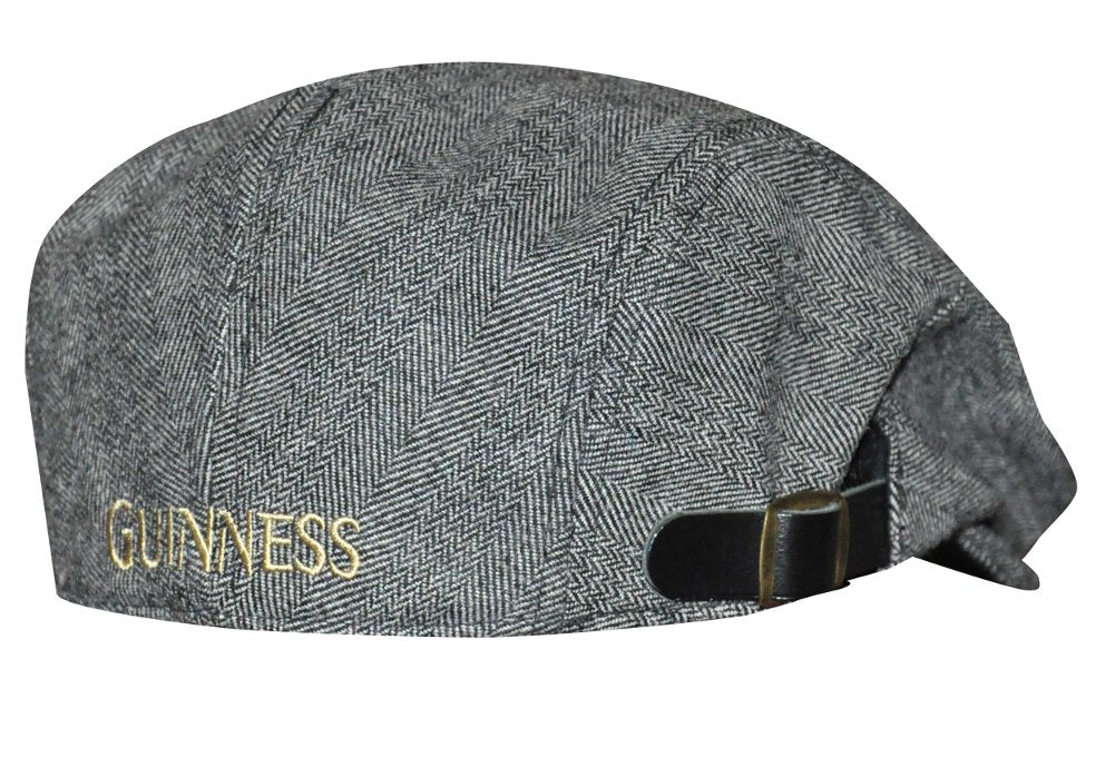 A Guinness Classic Tweed Buckle Ivy Flat Cap, a wardrobe essential.