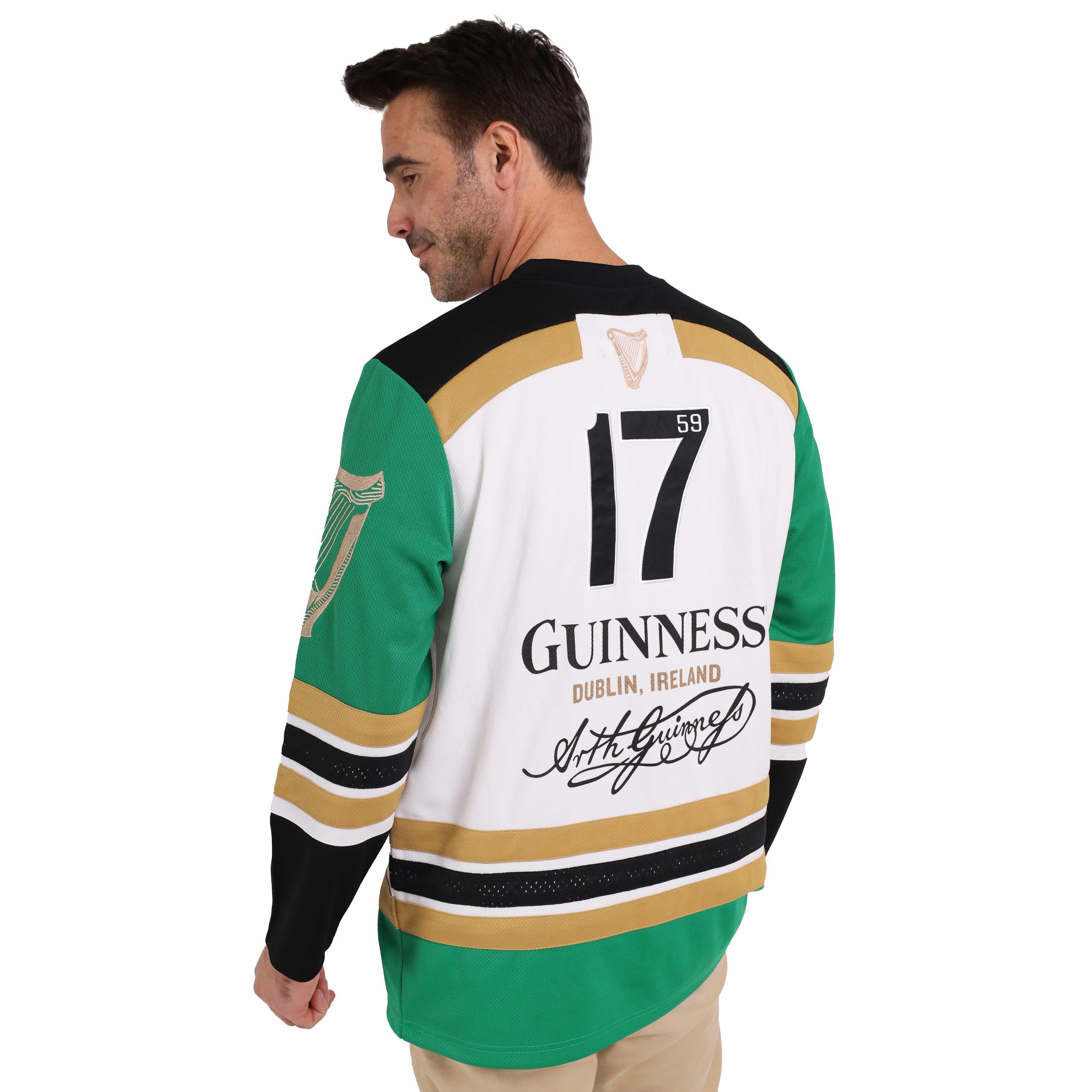 A man wearing a sustainable Guinness Toucan Hockey Jersey made from recycled polyester, featuring the iconic Guinness Toucan graphic.