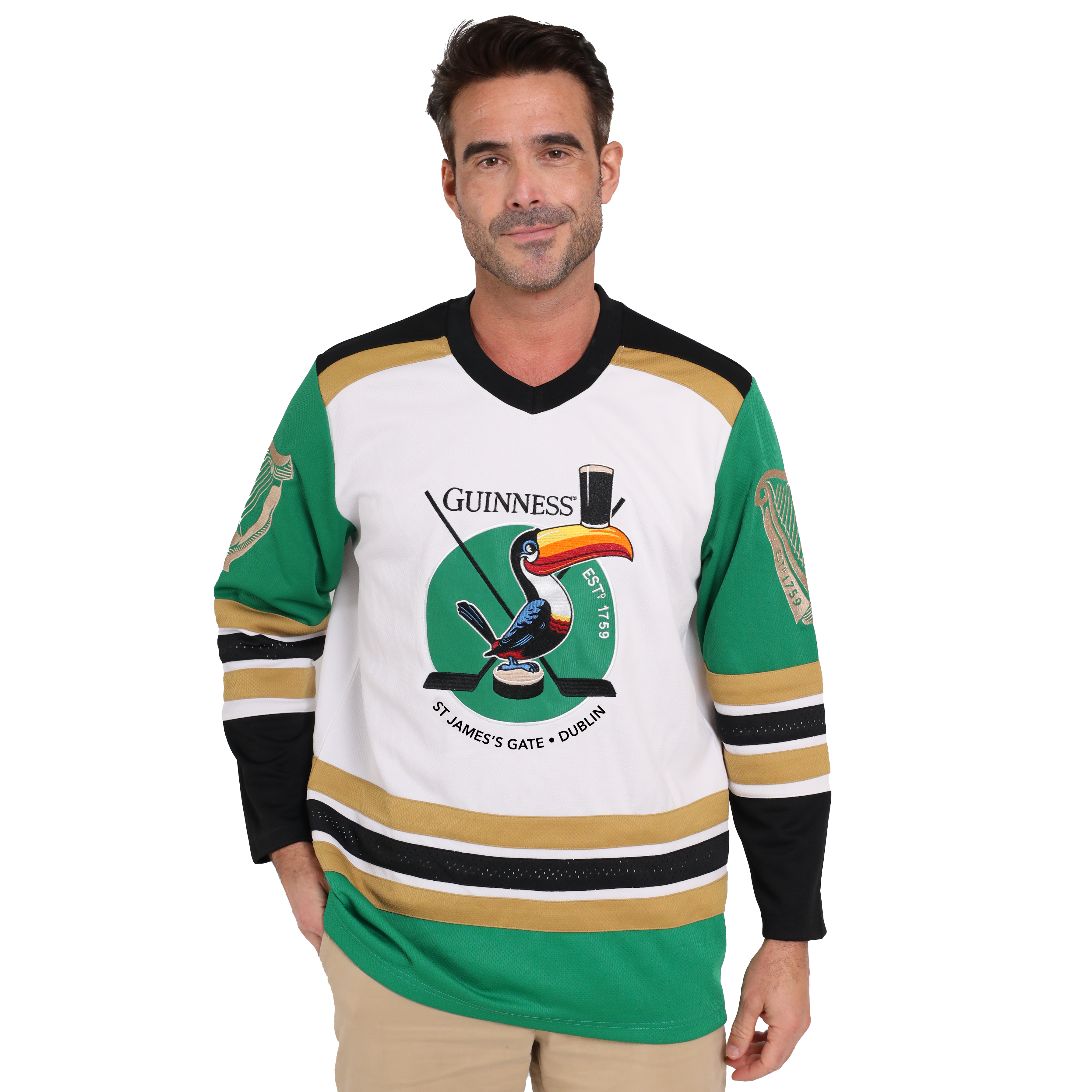 A man donning a Guinness hockey jersey made from sustainable materials and featuring the iconic Guinness Toucan graphic.