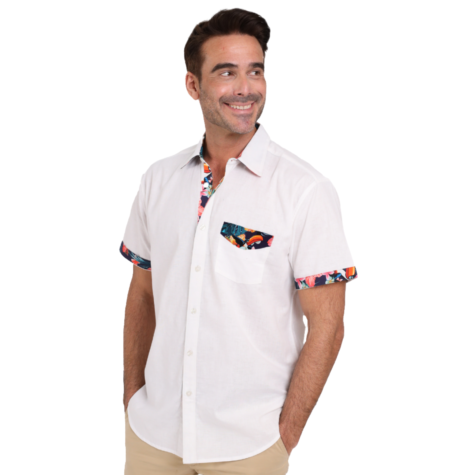 A man smiles while wearing a Guinness White Linen Summer Shirt with colorful trim on the pocket, collar, and sleeves. He has his left hand in his pocket and is looking off to the side, showcasing the casual elegance of Guinness Webstore US.